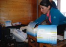 Maryam tests the urine using the DCA machine